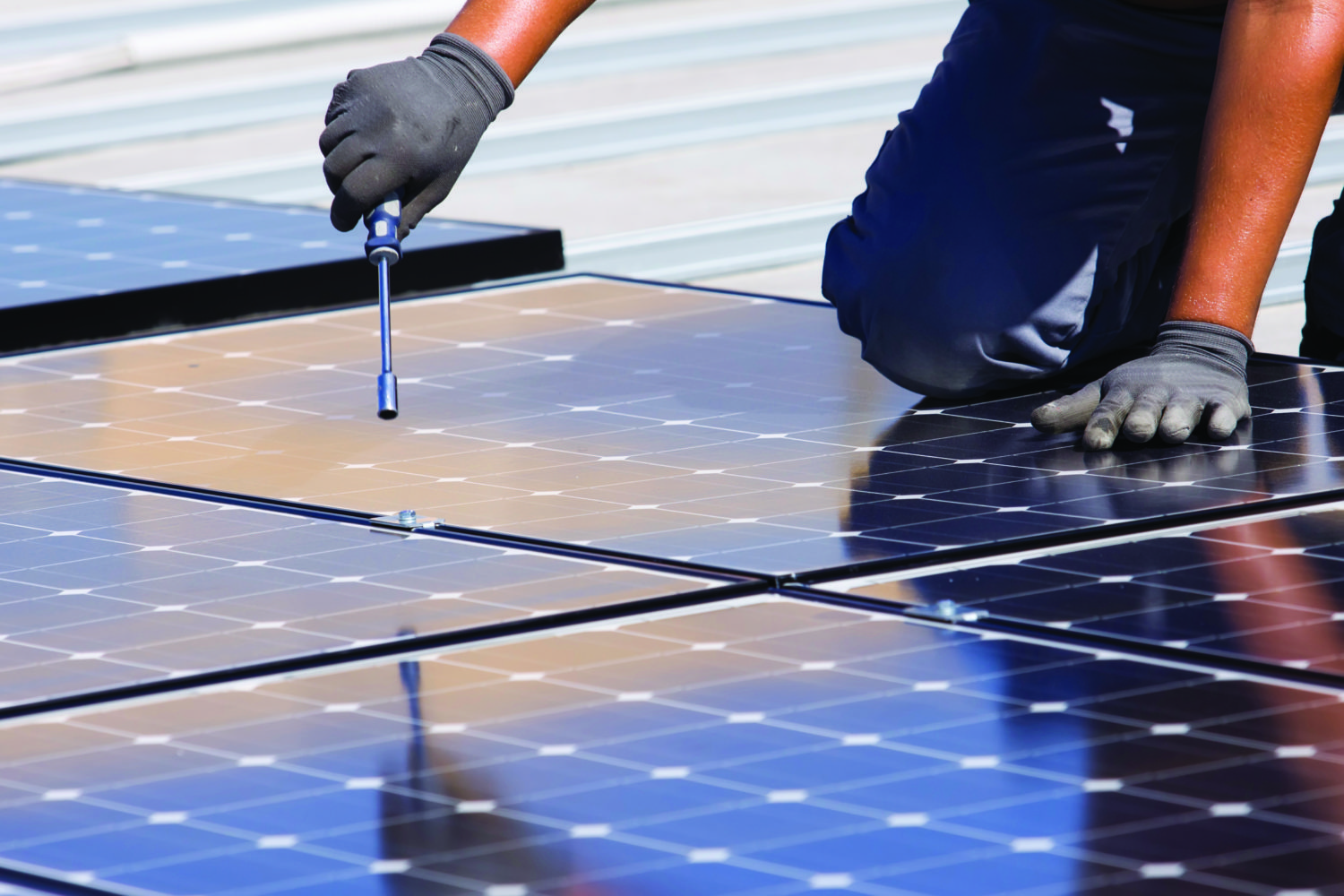 Man putting together solar panels